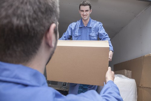 Professional team packing office items for relocation
