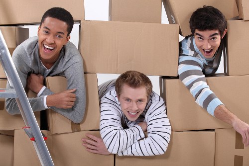 Professional packers from Belgravia Storage carefully wrapping household items